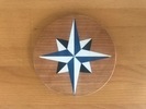 Nautical stars down in pine veneer marquetry.